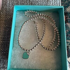 Perfect condition Tiffany heart necklace. Beaded choker with blue heart.16 in.